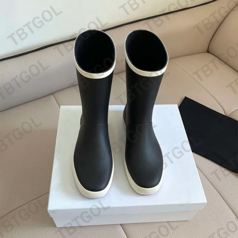 Botas de lluvia para mujer Botas de lluvia de goma de diseñador Bota hasta la rodilla de PVC 23FW Estilo casual Botas Welly impe